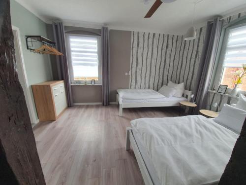 a small room with a bed and a couch at Haus Kabelitz in Kabelitz