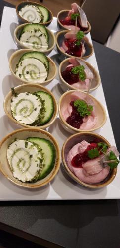 a tray of different types of food on a table at Haus Achtern Diek in erster Reihe am Meer in Fehmarn