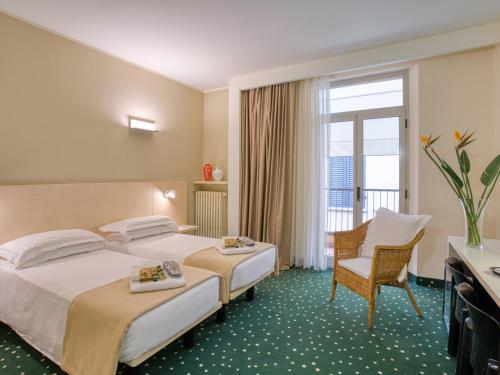 Ένα ή περισσότερα κρεβάτια σε δωμάτιο στο Hotel Piroscafo