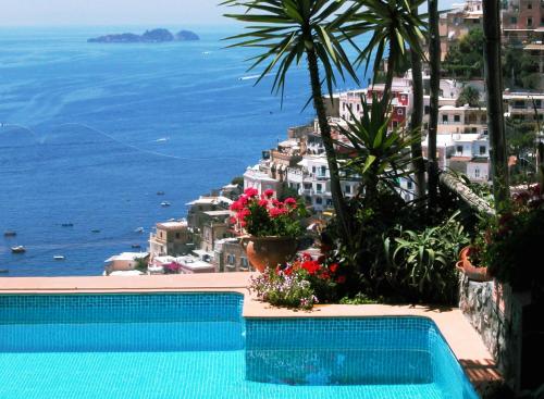 a swimming pool with a view of the ocean at Villa Fiorentino in Positano