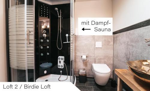 a bathroom with a shower and a toilet and a sink at Events and Stay in Neustadt/Harz