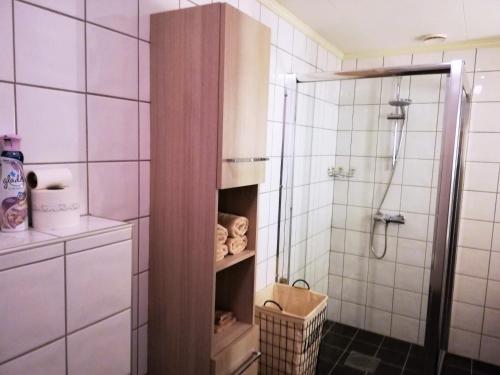 a bathroom with a shower and a walk in shower at Løvheim Gjestehus in Sauland
