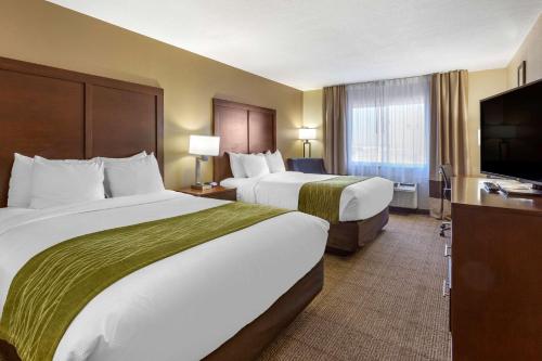 Кровать или кровати в номере Comfort Inn & Suites Alameda at Albuquerque Balloon Fiesta Park