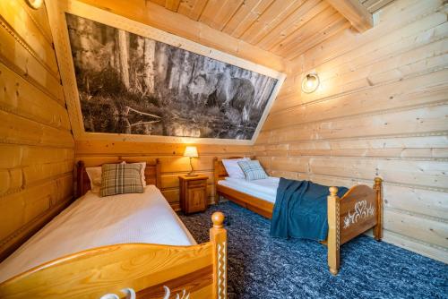 Letto o letti in una camera di Willa Pod Niebem