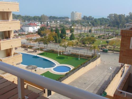 a view of a park from the balcony of a building at Apartamentos varios con 2 dorm en Marina Dor , la playa de Amplaries 47 , vista lateral al mar in Oropesa del Mar