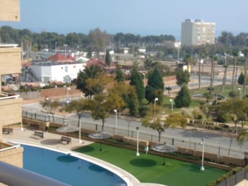 a view of a park with a pool and a city at Apartamentos varios con 2 dorm en Marina Dor , la playa de Amplaries 47 , vista lateral al mar in Oropesa del Mar