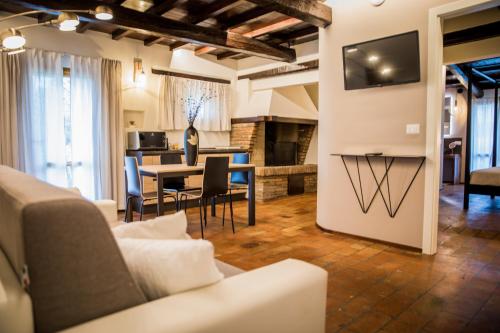 a living room with a couch and a table at Villa Ca' Viola Rimini in Rimini