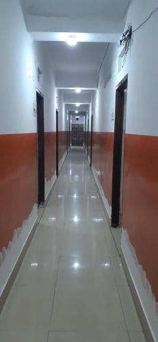 a hallway of a building with a long corridor at Hotel Yuvraj in Patna