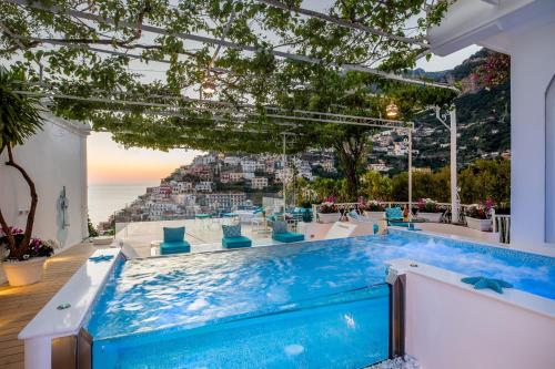 a pool in a house with a view of the ocean at Villa Fiorentino in Positano