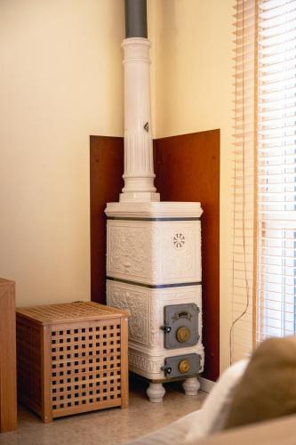 a white stove sitting in the corner of a room at Casa Bembo in Asolo