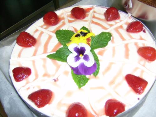 a cake with a flower on top of it at Chez Louis chambres d'hôtes à la ferme in La Canourgue