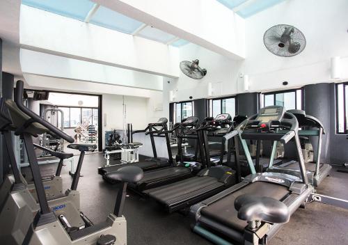 a gym with several tread machines in a room at Estanplaza Berrini in Sao Paulo