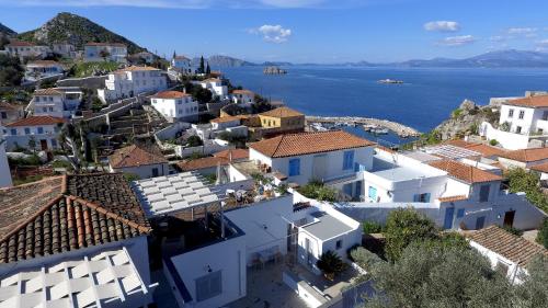 an aerial view of a town with the water at Villa Loukia in Hydra