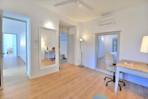a room with a desk and a room with a bedroom at Villa Loukia in Hydra