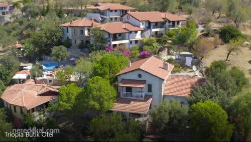 arial view of a villa in a resort at Şato Triopia Butik Otel in Yaka