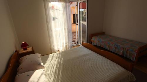 Ένα ή περισσότερα κρεβάτια σε δωμάτιο στο Apartments Vrbovčan