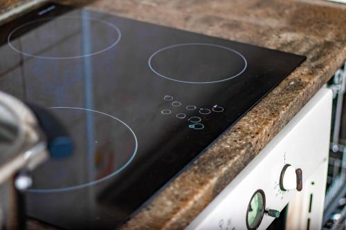 a close up of a stove top with a counter at RÉSIDENCE DOLCE VITA - BONANJO in Douala