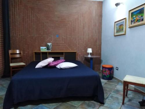 Ένα ή περισσότερα κρεβάτια σε δωμάτιο στο Casa degli aranci