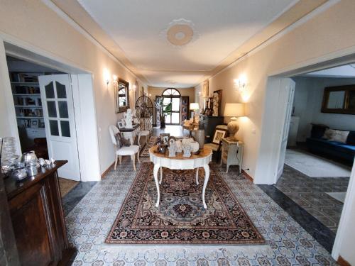 a living room with a table and some chairs at Casa Nives in San Pietro in Casale