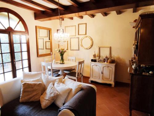 a living room with a couch and a table at Casa Nives in San Pietro in Casale