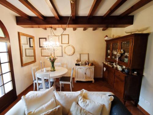 a living room with a couch and a table at Casa Nives in San Pietro in Casale