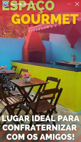a flyer for a restaurant with tables and chairs at Hotel de Trânsito da PM-PE in Olinda