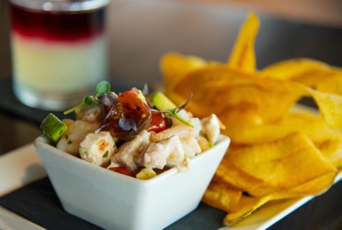 a white bowl of salad and chips on a tray at Cambria Hotel Downtown Asheville in Asheville