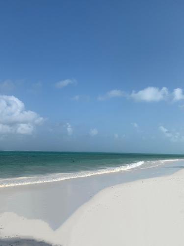 a sandy beach with the ocean in the background at VRclub Paje Palms Beach Resort in Paje