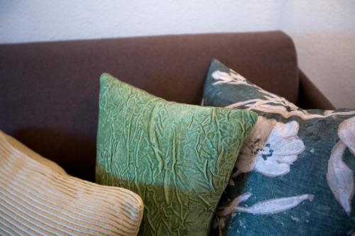 two pillows sitting on top of a couch at Appartements Berg 170 in Damuls