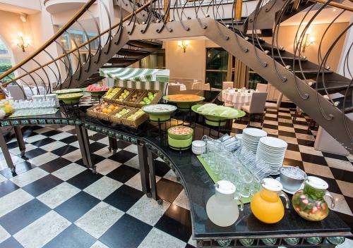 a buffet of food on a table in a building at Gran Estanplaza Berrini in Sao Paulo