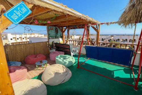 a pavilion with bean bags and a sign on it at Gina Motel Dahab in Dahab