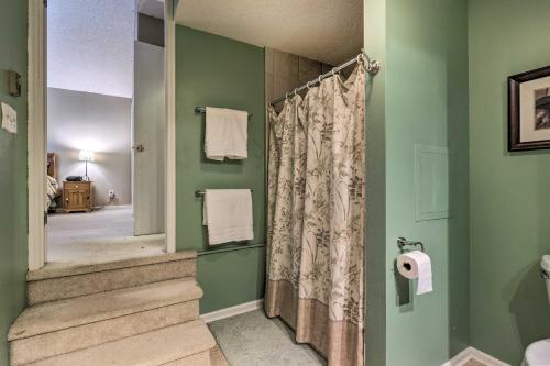 a bathroom with a shower with a shower curtain at Massanutten Retreat with Double Deck and Mtn View! in McGaheysville