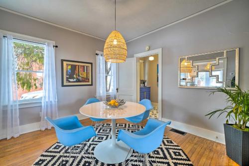 a dining room with a table and blue chairs at Pet-Friendly OKC Home, 3 Miles to Downtown! in Oklahoma City