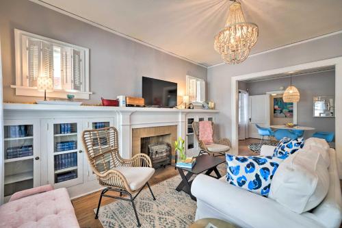a living room with a white couch and a fireplace at Pet-Friendly OKC Home, 3 Miles to Downtown! in Oklahoma City