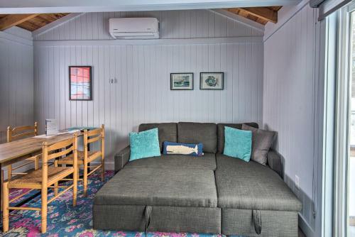 a bedroom with a bed and a table and a table and chairs at Charming Jacuzzi-Suite - Walk to Parsons Beach! in Kennebunk