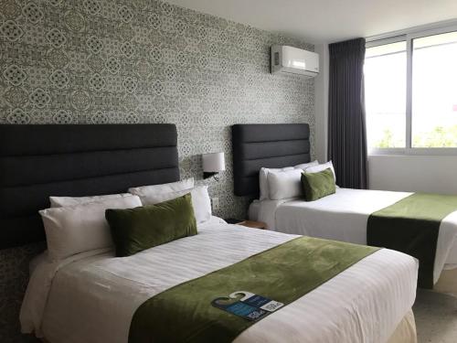 Postel nebo postele na pokoji v ubytování Hotel Ros Gaud