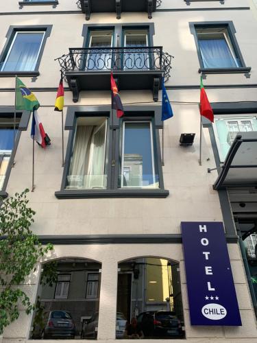 a building with flags on the side of it at Hotel Do Chile in Lisbon
