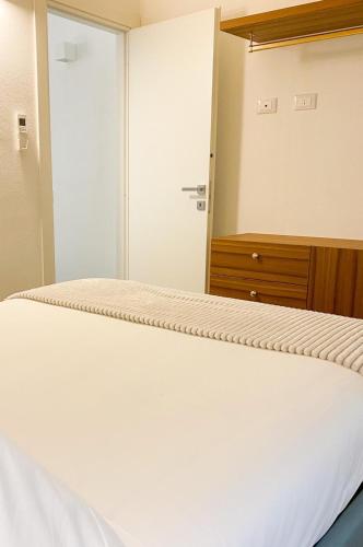 a bedroom with a bed and a closet at La Ripa Camere Vernazza in Vernazza