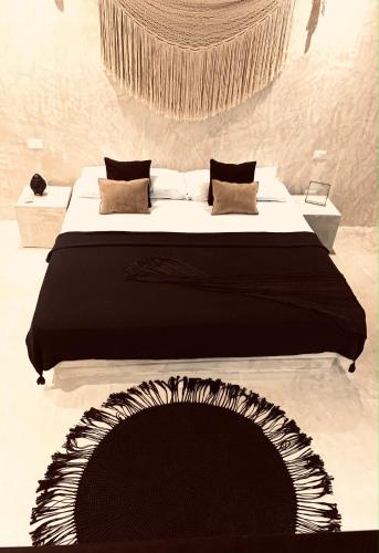 Ein Bett oder Betten in einem Zimmer der Unterkunft Apartments & Suites MADRE Holbox Self-Check IN