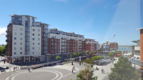 a view of a city with buildings and a street at Holiday Inn Express Portsmouth Gunwharf Quays by IHG in Portsmouth