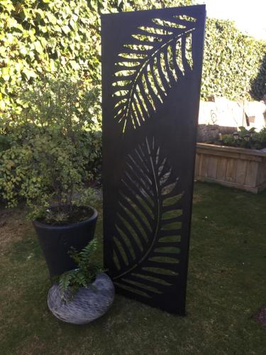 a black stand with a plant in a yard at Kingsley Quarters in Cambridge