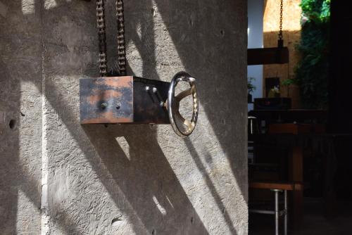 a metal padlock on the side of a wall at K. Gold in Taichung