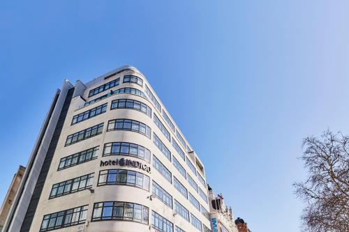 a tall building with the words rexbourne on it at Hotel Indigo London - 1 Leicester Square by IHG in London