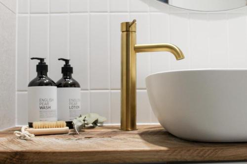 a bathroom counter with a sink and a sink at Coombs Hill Barn in Merrijig