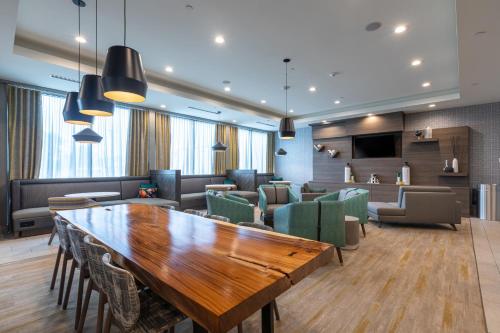 a conference room with a wooden table and chairs at Holiday Inn Greenville - Woodruff Road by IHG in Greenville