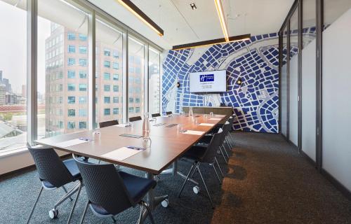 a conference room with a long table and chairs at Holiday Inn Express Melbourne Southbank by IHG in Melbourne
