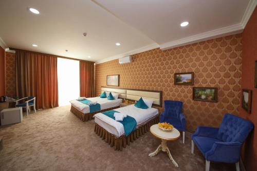 Ένα ή περισσότερα κρεβάτια σε δωμάτιο στο HOTEL GLOBUS