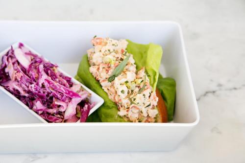 a white container with two different types of food in it at Kimpton Rowan Palm Springs Hotel by IHG in Palm Springs
