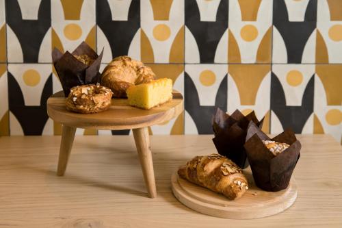 a couple of plates of pastries on a table at Kimpton Rowan Palm Springs Hotel by IHG in Palm Springs