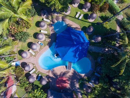 an overhead view of a pool with an umbrella at Sunbird Nkopola in Chipoka